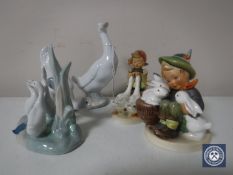 Three Nao figures of ducks together with two Hummel figures of a goose girl and a boy with rabbits