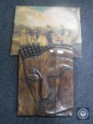 An Eastern wooden relief panel of Buddha together with an unframed textured print on canvas of