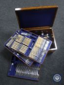 A Victorian oak canteen with three lift-out trays of assorted plated and stainless steel cutlery