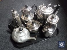 A tray of seven assorted antique silver plate and pewter tea and coffee pots