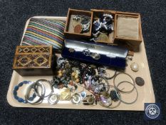 A tray of silver and costume jewellery, enamel bangles,