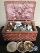 A mid 20th century wicker sewing box containing miscellany including cufflink's, desk clocks,