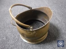 A Victorian brass coal scuttle