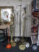 Eight assorted continental floor lamps