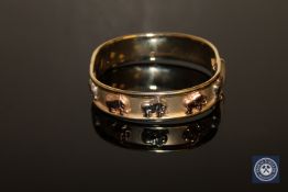 A three-tone gold bangle stamped 375 Italy CONDITION REPORT: 24.