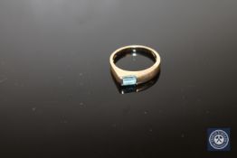 A 9ct gold ring set with a blue zircon, size N, boxed.