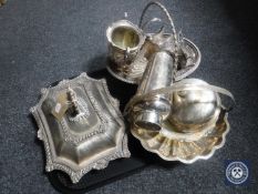 A tray containing antique plated wares including entree dish and cover, swing handle basket,