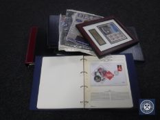A box containing seven albums and a frame of commemorative coin and stamp covers together with four