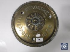 A circular brass ship builders plaque stamped 'DYNOMENE, LIVERPOOL 1882',