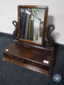 A Victorian pine dressing table mirror on fish supports