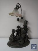 A figural table lamp,