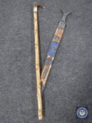A Persian style sword in scabbard and a horn handled walking stick