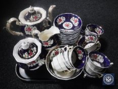 A tray of thirty-three pieces of Victorian lustre tea china