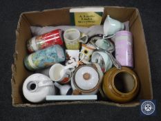 A box containing cushion, silver-backed hand mirror, tea caddies,
