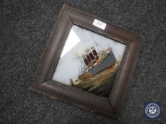 A framed antique painting on glass of a steam ship
