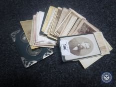 A quantity of Victorian photographs and an Art Nouveau photo frame