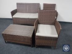 A four-piece rattan patio set