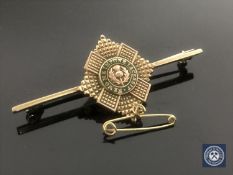 A 9ct gold and enamelled Scottish bar brooch CONDITION REPORT: 4.