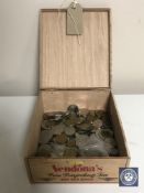 A wooden tea box containing pre decimal English coins, foreign coins,