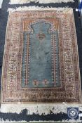 A Kayseri prayer rug, Anatolia, on turquoise ground with cream borders,