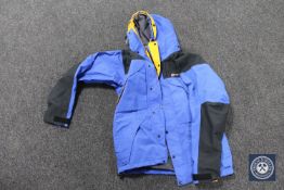 A Berghaus Mera Peak man's jacket, blue, size medium.