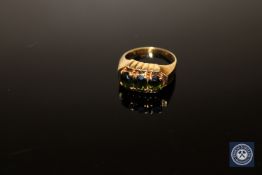 A 14ct gold three-stone green tourmaline ring, size O CONDITION REPORT: 3.