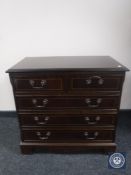 An inlaid mahogany five-drawer chest