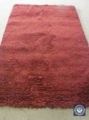 A hand knotted rug, shaggy maroon, 180 cm x 270 cm, rrp £681.