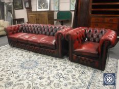 A four-seater oxblood leather Chesterfield buttoned settee, width 230cm,