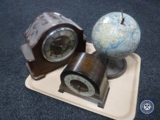 A mid 20th century Chad Valley tin plate globe and two oak cased Smiths mantel clocks