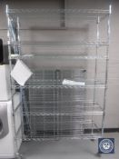 Two sets of portable chrome wire shelves