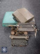 An early 20th century continental typewriter (a/f) and three cased typewriters