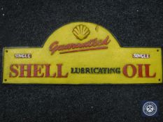 A cast metal plaque "Shell Lubricating Oil"