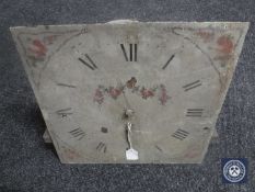 A 19th century longcase clock movement with hand painted dial