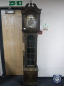 An oak cased Tempus Fugit grandfather clock with weights