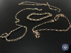 A 9ct gold bracelet, two similar chains,