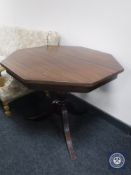 A mahogany octagonal pedestal occasional table