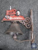 A cast metal door bracket with bell "Farmall Tractors"