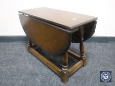 An oak dropleaf coffee table