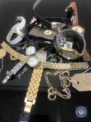 A tray of various wristwatches, Zippo lighters, silver and gilt metal jewellery,