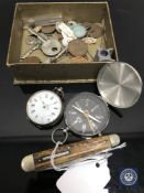 A box of tobacco tin, fob watch, pen knife, keys,