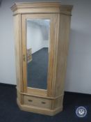 A Victorian pine glazed door corner wardrobe