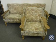 A blonde oak framed three seater settee and chair