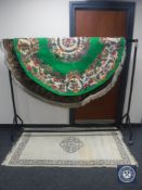 A circular green floral rug,