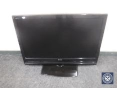 A Hitachi 37" LCD TV with remote