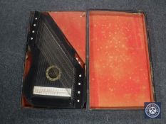 An early 20th century cased Royal harp zither