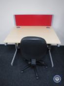 An office work station with divider and swivel office armchair