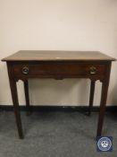 A George III oak side table fitted a drawer,