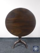 A Victorian mahogany tilt top pedestal occasional table