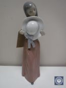 A Lladro figure - girl with hat